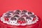 Chocolate cake balls in red and white dot liners on red plate