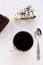 Chocolate cake. Black hot tea. White background