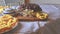 Chocolate cake with cherries, grated chocolate and whipped cream. Homemade cream puffs on festive table. Vintage sugar bowl. Close