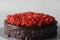 Chocolate cake with chocolate ganache and topped with fresh strawberries for a valentines day date