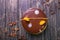 Chocolate cake with decor and biscuit, jelly, berries and mint on a wooden stand