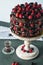 Chocolate cake decorated with fruits on stand