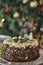 Chocolate cake with fresh fruits with Christmas decoration