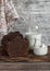 Chocolate cake, milk bottle, yogurt on wooden background