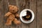 Chocolate cake on a plate and next to a brown children`s teddy bear, birthday