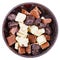 Chocolate candies and broken bars in ceramic bowl
