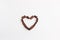 Chocolate candies shape heart valentines background white cardboard