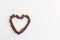 Chocolate candies shape heart valentines background white cardboard