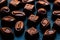 Chocolate Candy Sweet Wallpaper- sweet food collection. Dark Chocolate Candies over black background.