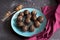 Chocolate candy truffles on dark background. Delicious treat, sweet dessert