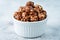 Chocolate caramel sweet Popcorn in a white bowl