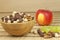 Chocolate cereal balls in a bowl of bamboo. Healthy breakfast with fruit and milk. A diet full of energy and fiber for athletes