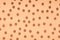 Chocolate cereal pattern on orange background