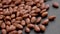 Chocolate cereal puffed rice grains on a black background