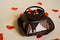 Chocolate cheesecake with small red hearts. Valentine`s Day