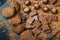 Chocolate chip cookies, broken pieces of chocolate and cocoa powder on a wooden background