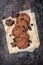 Chocolate chip cookies on rusty metal baking sheet