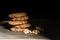 Chocolate chip cookies stacked up on a plate in low light, AF point selection