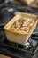 Chocolate Chip Pumpkin Bread in Stoneware Loaf Pan on Stovetop