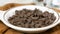 Chocolate chips falling onto a small bowl super slow motion