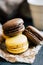 Chocolate and citron macaroons on a wooden background