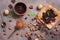 Chocolate, cocoa powder, a variety of nuts and mint leaves on a dark brown rustic background. View from above,flat lay