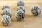 Chocolate coconut balls decorated with shredded coconut on wooden bamboo table