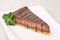 Chocolate or coffee cheescake with mint leaf on white plate, gluten free cake, product photography for patisserie