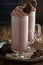 Chocolate cookie milkshake in tall mugs