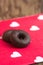 Chocolate and cookie sweets on a red napkin with hearts