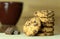 Chocolate cookies and cocoa. Wooden background. Close up view.