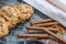 Chocolate cookies, on rustic wood next to cocoa in different forms