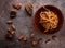 Chocolate cookies, stacked and tied with a rope, pieces of black chocolate, and scattered cocoa beans on a textured background.