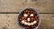 Chocolate cornflakes with honeycomb cereal forming smiley face in bowl 4k
