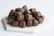 Chocolate covered Turkish delight on a white background