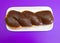 Chocolate covered twist donut on rectangular plate purple background