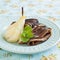 Chocolate crepes with poached pear in syrup