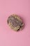 Chocolate crocante cookies with nuts on a pink background