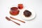 chocolate croissant bread danish on plate and tea on white background