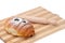 Chocolate croissant on a wooden board with rolling pin