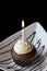 Chocolate Cupcake with a Burning Birthday Candle