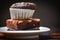 Chocolate cupcake on the Chocolate Brownie on white palte with dark