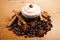 Chocolate cupcake, coffee beans, cinnamon, star anise on sacking