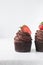 Chocolate cupcake with dark chocolate buttercream and strawberries, double chocolate cupcakes with american buttercream