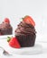 Chocolate cupcake with dark chocolate buttercream and strawberries, double chocolate cupcakes with american buttercream