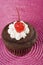 Chocolate Cupcake with Vanilla Icing and Cherry