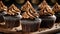 Chocolate cupcakes with beige ganache frosting. Dessert with whipped cream. Sweet and tasty food