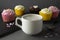 Chocolate cupcakes and coffee , breakfast with colorful cupcakes. Gray background. Sweet dessert