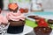 Chocolate cupcakes with strawberry cream. Decorated with half strawberries in chocolate