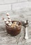 Chocolate dessert with cookies in glass beakers